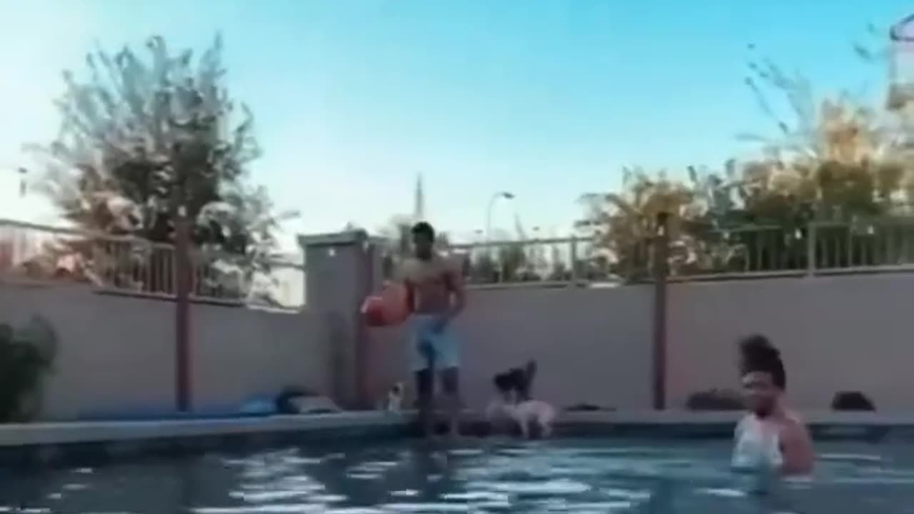 Britney Griner shooting hoops with his man pecs. It's a dude