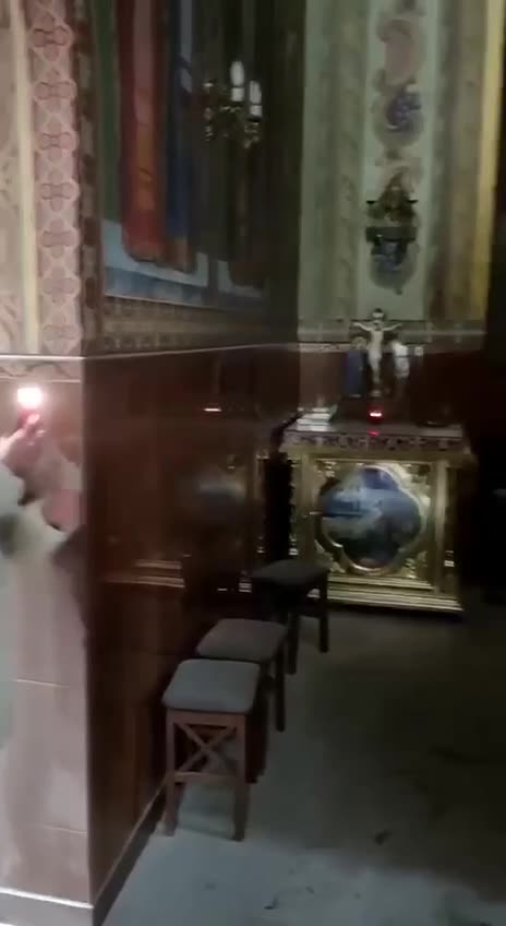 Ukrainian to an Orthodox Church breaking through the doors.