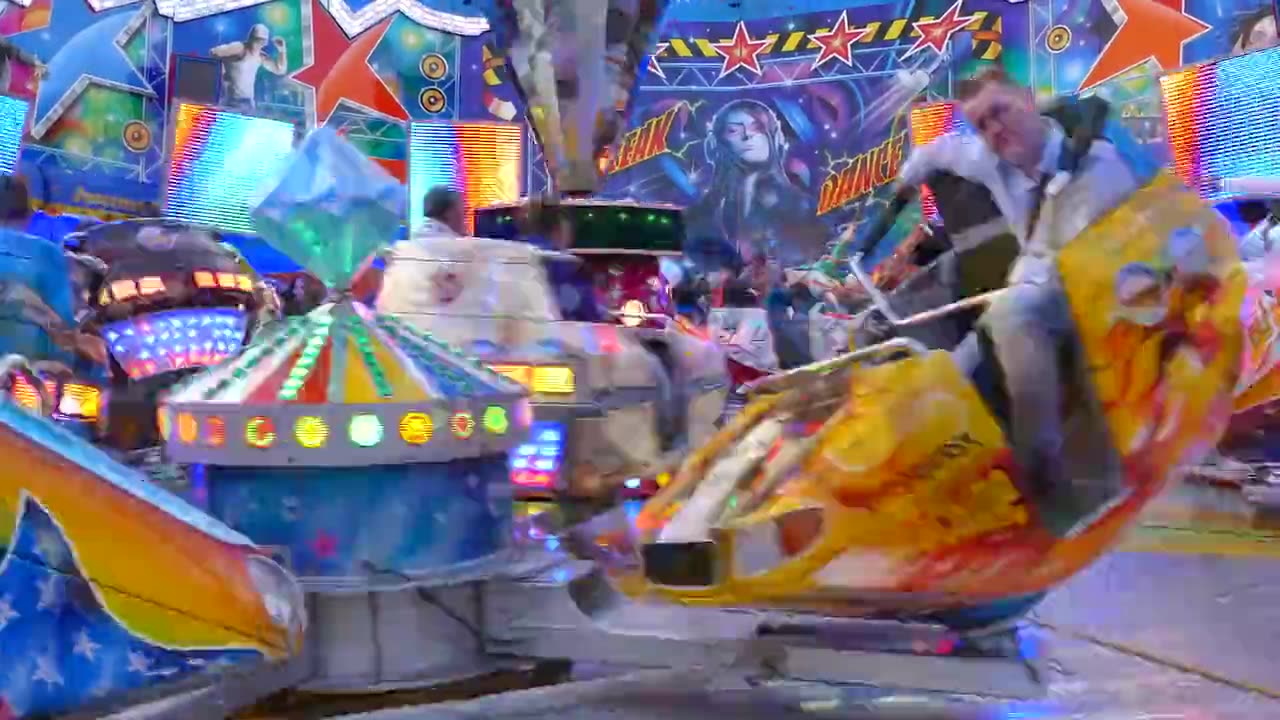 People Having Fun Riding Rides at Fair