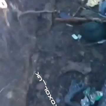 Ukrainians leave fallen comrades,who literally becomes one with the Trench