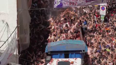 Thousands take part in the Tomato Throwing Festival in Spain