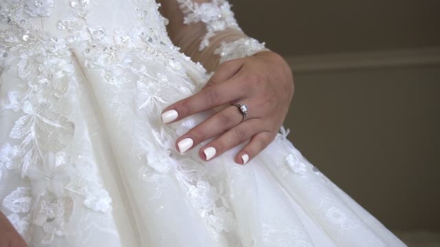 footages for video editing hands of the bride gently stroking the clothes dress 1