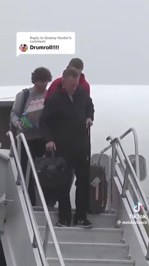 Gavin Newsom slips down stairs.