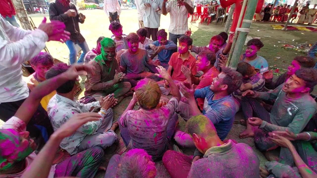 During holi festival in assam the boys are singing and enjoying