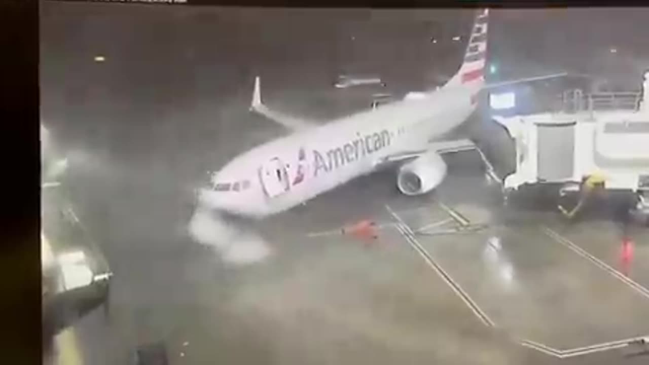 American Airlines 737-800 moved from its gate at Dallas Airport because of weather conditions