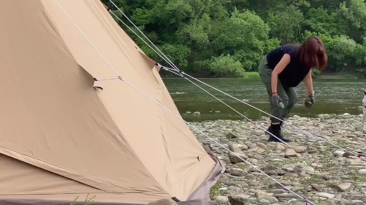 One person, one dog, camping by the river, enjoying the pleasure of exquisite camping