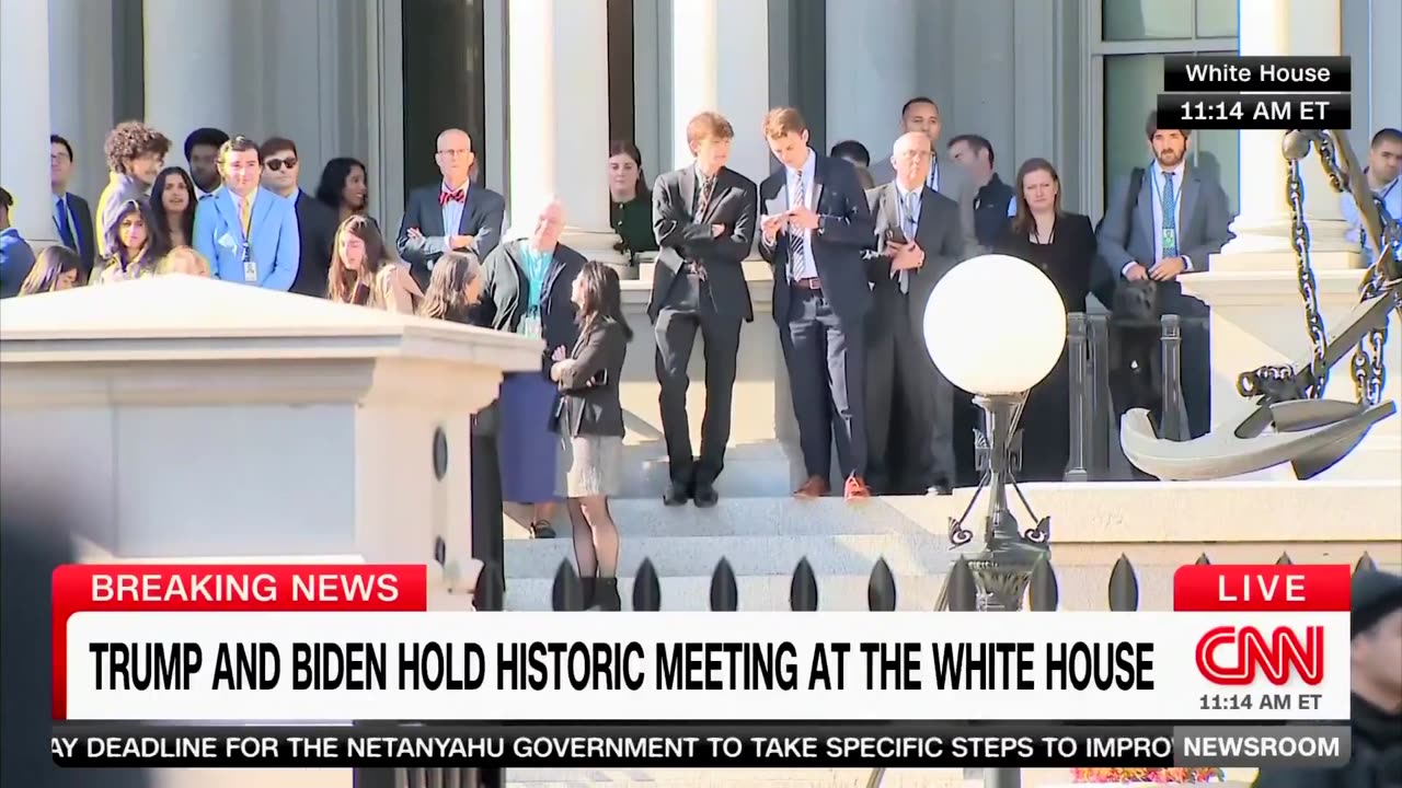 Biden Staffers come out to catch a glimpse of President Trump arrive in DC