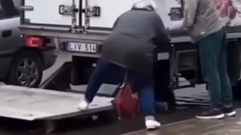 Truckers help an elderly woman get to her car!