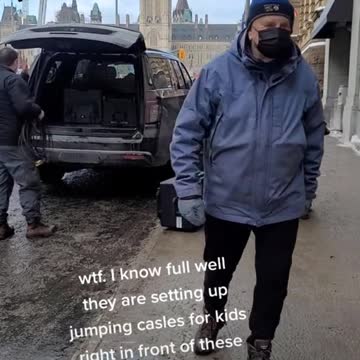 Black SUV pulls up unloads what?