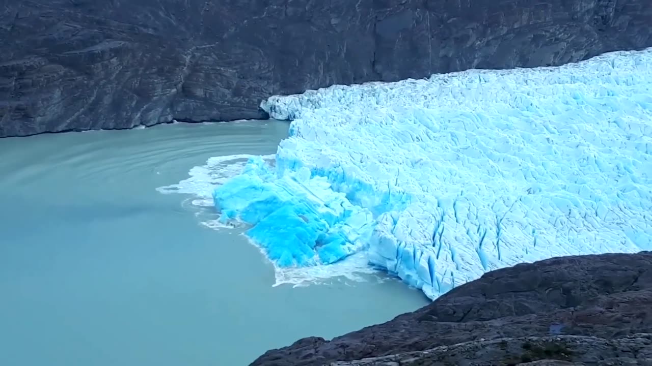 ICEBERG FLIPPING OVER REVEALING VERY OLD BLUE ICE