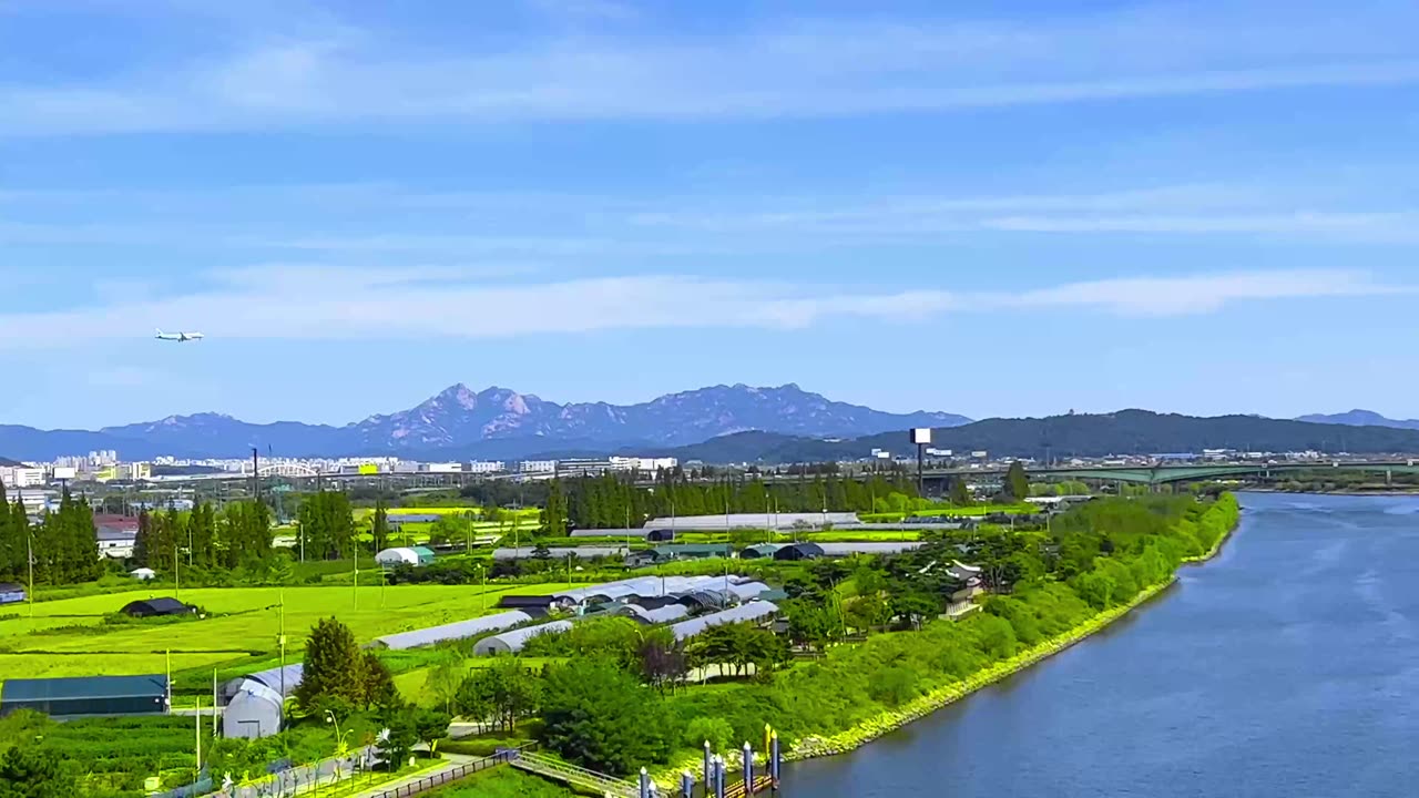 an airplane flying low over a river