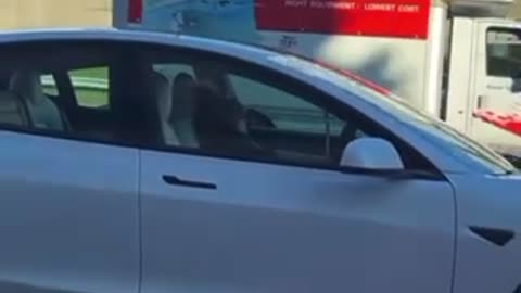 Woman sleeping while driving tesla