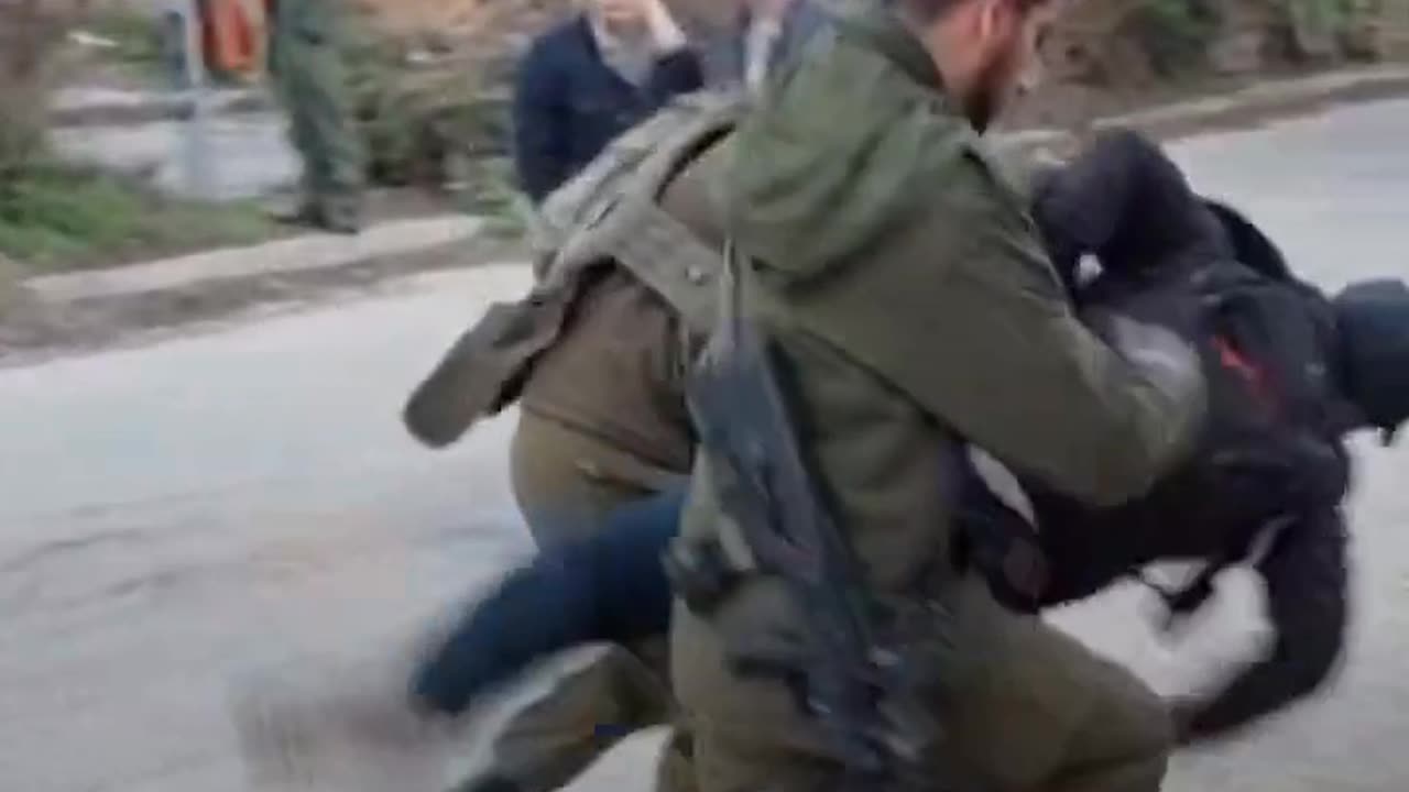 Israeli soldier assaults Palestinian activist in full view of camera