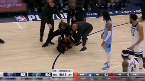 Security drags animal rights protester out the Timberwolves grizzlies playoff game