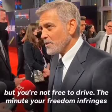 Actor George Clooney being paid to read lines and be a useful idiot