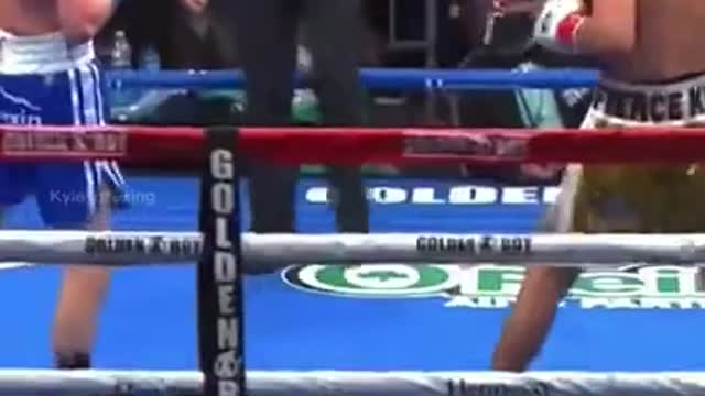 Boxer Practices His Punches with Training Mits in the Boxing Gym