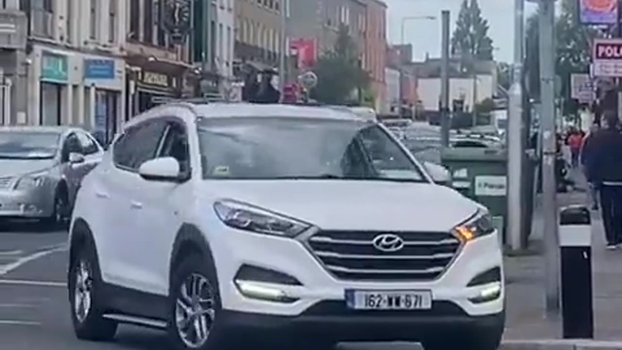 Ireland: immigrant jumps onto a random persons car and refuses to get off.