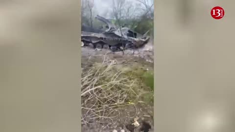 Ukrainian soldiers display Russian armored fighting vehicles burned to pieces after strike