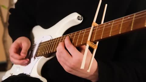 Japanese Guitarist Play a Guitar with Chopstick