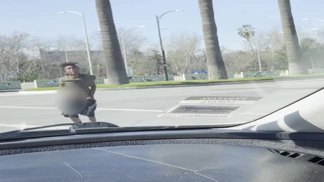 Irate Woman Approaches Car at Crosswalk