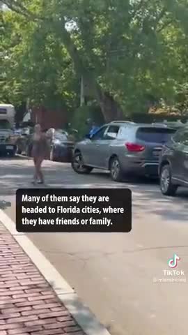 MARTHA'S VINEYARD RESIDENTS CHEER AS ILLEGAL IMMIGRANTS ARE LED TO A BUS TO A MILITARY FACILITY.