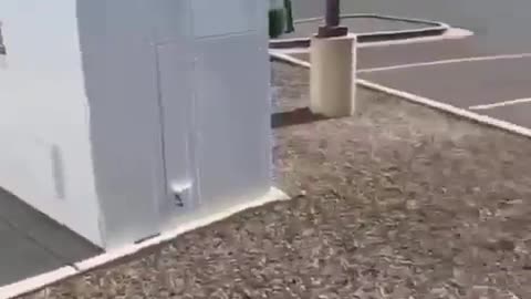 Man measure ma EMF radiation at empty electric charging station.