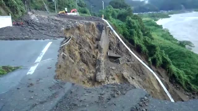 Landslide sweeps away road in Japan typhoon