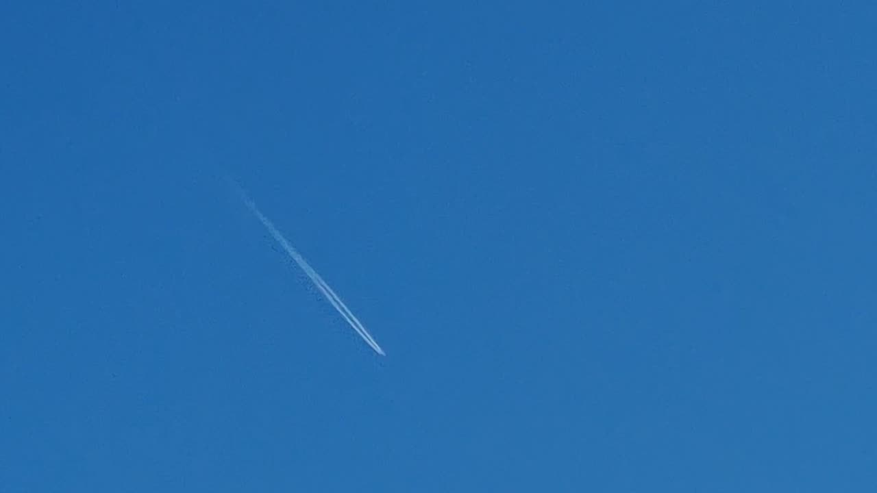 Contrail Behind Aeroplane Above North Wales.