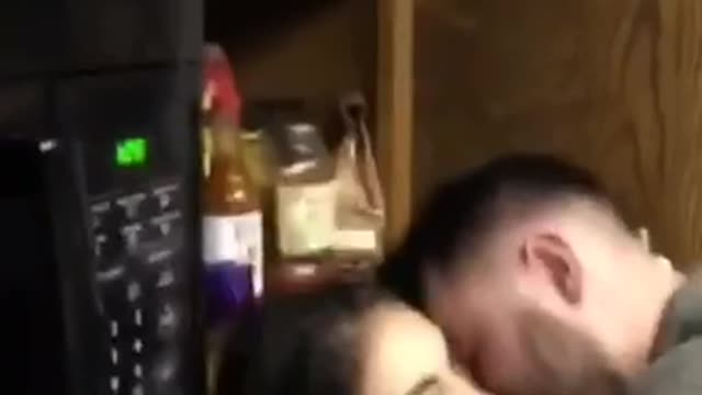 Nsfw woman checks phone while making out with guy in house party