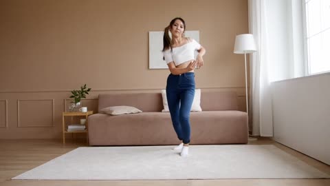 A Woman Dancing At Home