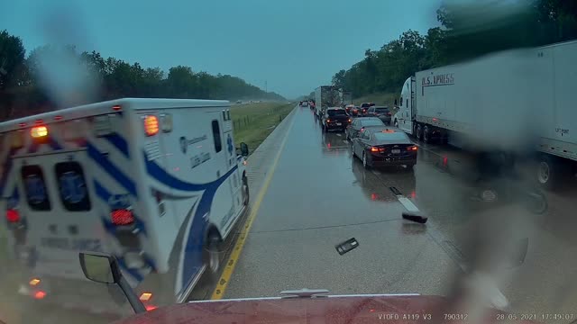 Ambulance Driver Clips Truck Mirror during Response