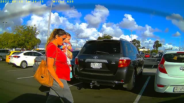 Young mum and baby walk into path of reversing car