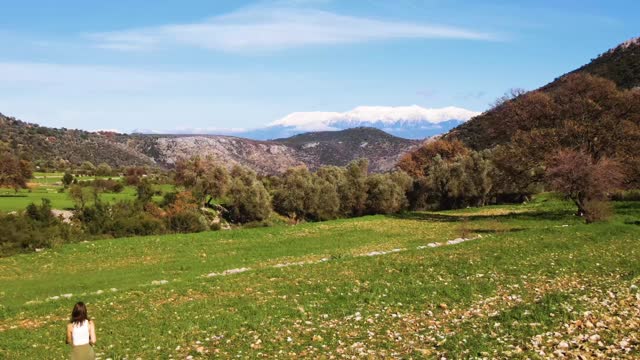 A Person Walking on a Farmland