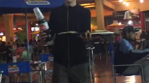 Guy carrying plate of food drops it