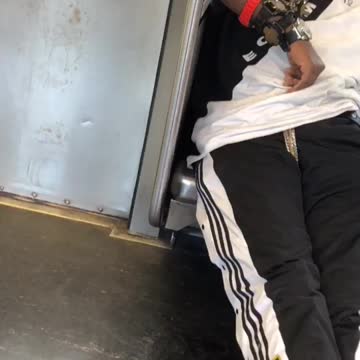 Guy sleeping on subway wearing four watches on his arm