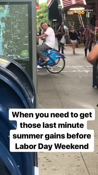 Old guy green bike back pedaling street