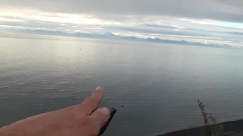 Augustine volcano, Iliamna Mountain and Redoubt Mountain, calm evening.