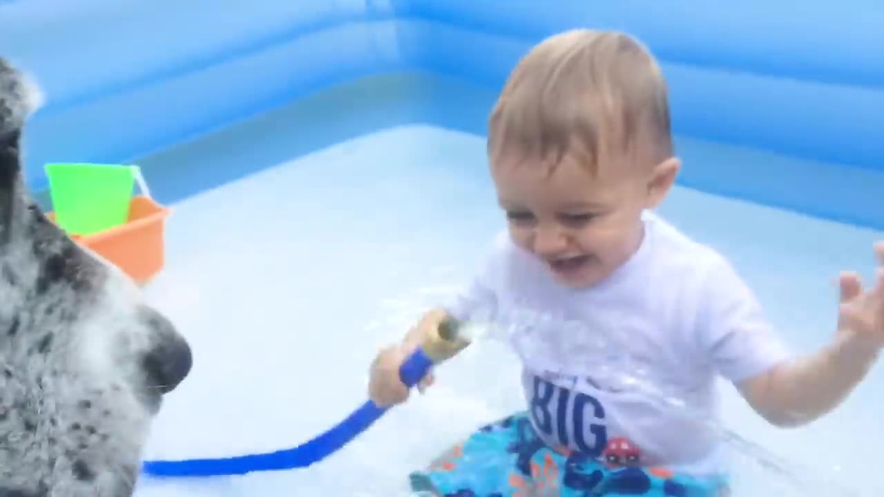 Funny baby playing with water