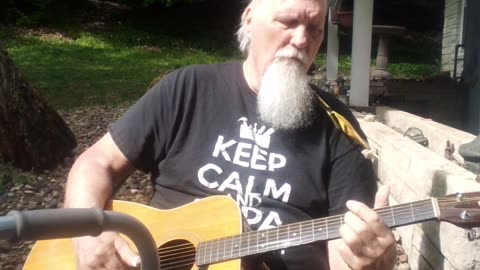 Guitar break on the driveway wall