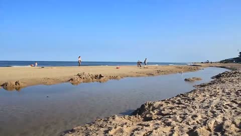 Sea Water Waves And Sandy Beach