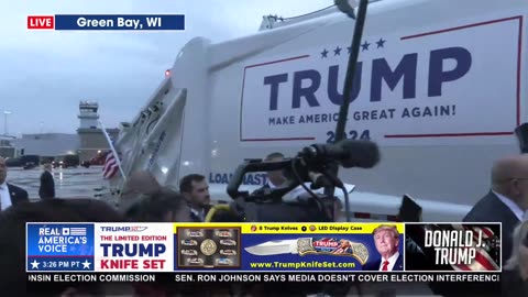 TRUMP RIDING IN A GARBAGE TRUCK TO TONIGHT'S RALLY.