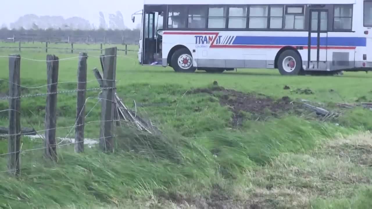 Extreme winds in New Zealand push school bus off road