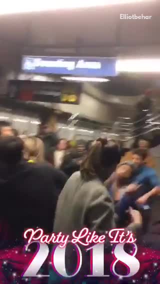 Dance music playing in subway station full of people