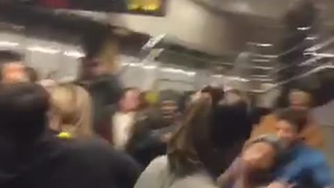 Dance music playing in subway station full of people