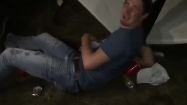 Blue t shirt guy jumps from garage onto beer pong table back yard party