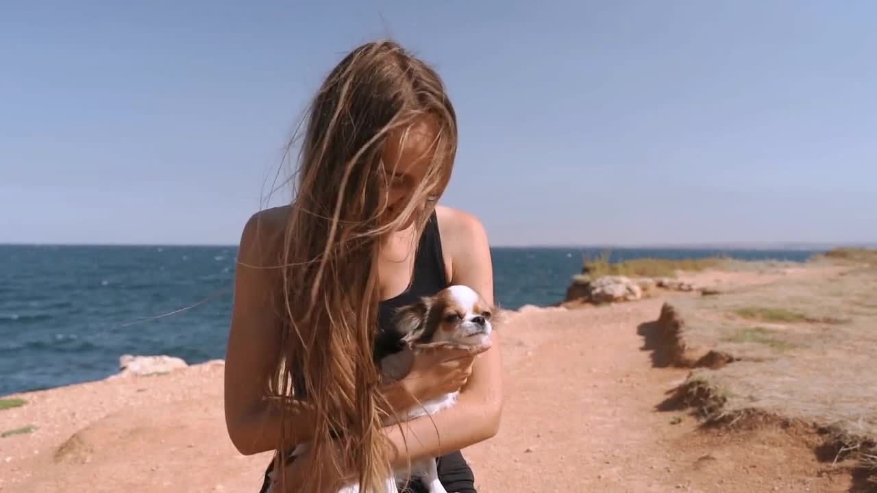 Young adult woman spending time in travel together with dog