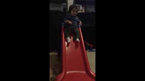 Collab copyright protection - baby boy on red slide faceplant