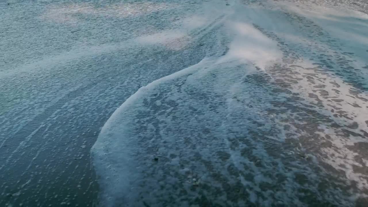 Sea wave on the sand