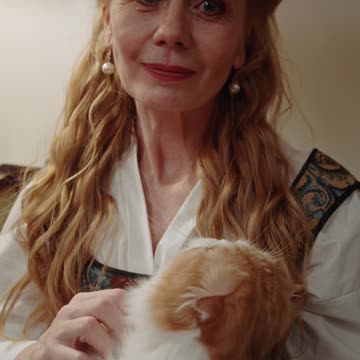 A Woman Petting Her Furry Cat--FH