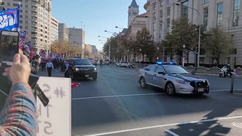 Donald Trump waves to his supporters in Freedom Plaza